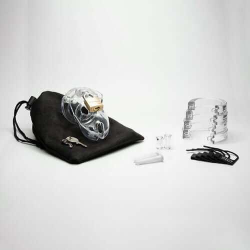 CBX Mr Stubb 1.75 inches clear chastity cage kit with accessories and pouch, ideal for sensual restraint.