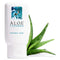 Aloe Cadabra Organic Lubricant 2.5 oz bottle beside fresh Aloe Vera leaves.