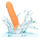 Neon Silicone Studs 6 Inch Orange pleasure toy splashing in water, vibrant and lifelike for sensational satisfaction.
