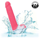 Rechargeable 7" vibrating thrusting dildo with suction base splashing in water, IPX7 waterproof submersible sex toy for intense pleasure
