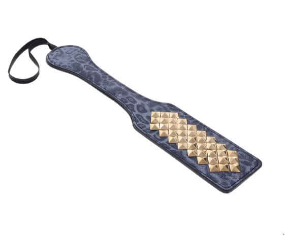 Blue leopard-print faux leather paddle with gold studs, featuring a sleek design for stylish impact play.
