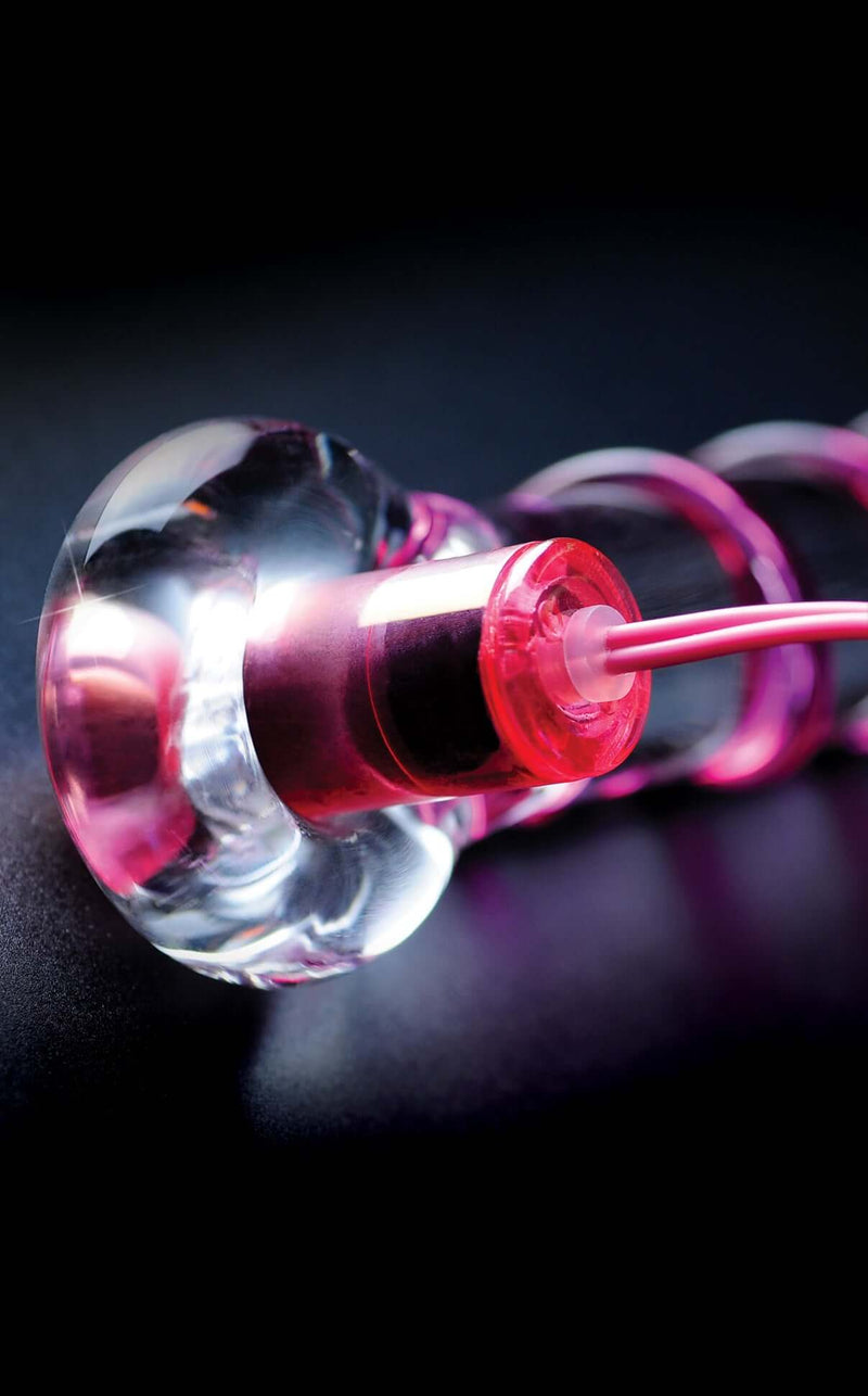Close-up of Icicles No. 4 10-Function Glass G-Spot Vibrating Wand with pink ribbon detail for enhanced pleasure and upscale design.