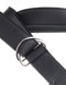 Close-up of black strap on harness featuring metal ring and adjustable straps for secure fit.