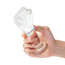 Hand holding Gläs 5 Inch Glass Fist Butt Plug with realistic hand texture and tapered base for secure anal play.