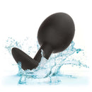 Weighted Silicone Plug with ergonomic design splashing in water, enhancing sensory pleasure with a 0.57 oz. ball, body-safe material.
