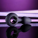 Evolved My Precious vibrating plug with ringed handle against purple and black background