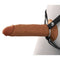 Brown silicone hollow strap-on with harness for enhanced strap-on play.