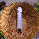Purple Fantasy Vibrator with chrome-finished ring handle on textured golden surface