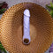 Purple Fantasy Vibrator with chrome-finished ring handle on textured golden surface