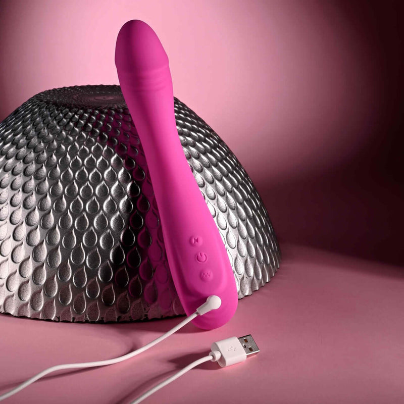 Evolved Sugar Rush G-Spot Vibrator in pink, multi-speed silicone vibe with turbo mode, shown with USB charging cable