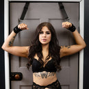 SEI MIO Doorway Control Play Adjustable Over Door Cuff Restraints in use with a model against a doorway.
