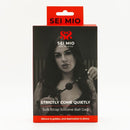 SEI MIO Strictly Come Quietly Soft Strap Silicone Ball Gag packaging featuring a stylish design and a model holding the gag.
