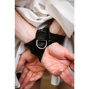 SEI MIO Cross Purposes Unique Over-Wrap Cross Cuff Restraints on wrists, featuring secure and comfortable design for bondage play.