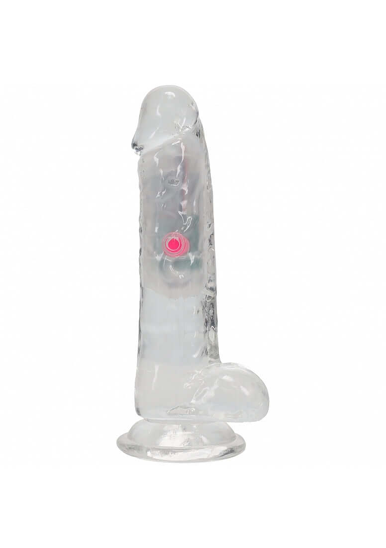 RealRock Vibrating Dildo 6 inch with Balls and Remote Control in transparent design with a pink button.