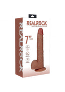RealRock Vibrating Cock with Balls 7 inch Caramel packaging featuring realistic design and suction cup base.