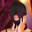 Sei Mio Hoodwinked And Kinked Deprivation Hood worn by a person, showcasing its sleek design and sensory play features.