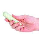 Softies Dual Layer Vibrating Bullet 4 inches Green in a hand, showcasing its silky-smooth design and compact size.