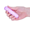 Softies Dual Layer Vibrating Bullet 4 inches Purple held in a hand, showcasing its compact design.