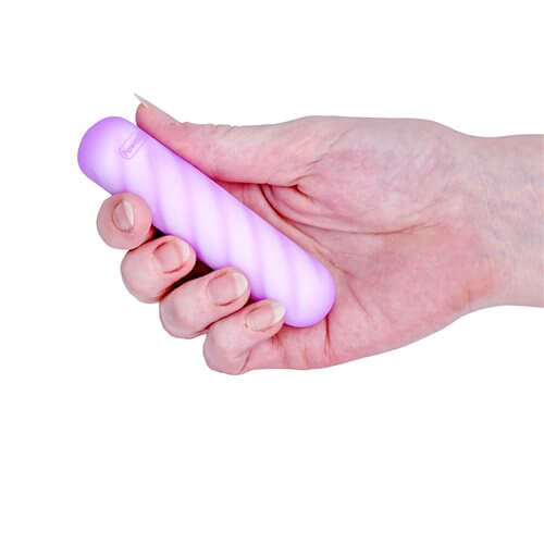 Softies Dual Layer Vibrating Bullet 4 inches Purple held in a hand, showcasing its compact design.