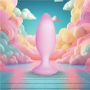 Softies Dual Layer Butt Plug 4 inches Pink surrounded by pastel-colored clouds and a dreamy background.