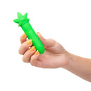 Person holding a green STONI Silicone Mini Vibe with a leaf-shaped design, featuring compact size and USB rechargeable functionality.