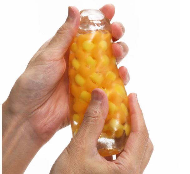 Person holding the Tenga Arte Weave Stroker, showcasing its unique internal texture for pleasurable sensations.