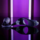 Zero Tolerance Tip to Tail Vibrating Plug & Penis Ring with flexible tail on reflective surface with purple background