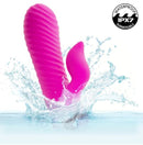 Extra Thicc Chubby Gyrating Rechargeable Silicone Tickler Pink splashing in water with waterproof features.