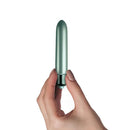 Hand holding Touch of Velvet Peacock Petals Bullet Vibrator from Rocks Off Toys, 3.54-inch compact and silky-smooth vibrator for precision stimulation