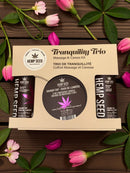 Earthly Body Hemp Seed Massage in a Box Gift Set Skinny Dip with tranquil flowers and massage kit products.