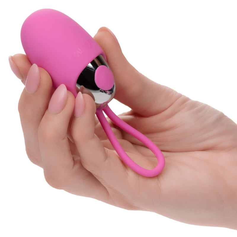 Holding Turbo Buzz™ Bullet with Removable Silicone Sleeve - Pink in hand for intense pleasure and powerful sensations