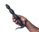 Maia Mason Remote Control Silicone Butt Plug Black held in hand, showcasing its sleek beaded design and remote function.
