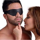 Couple enjoying sensory play with Strict Leather Velcro Blindfold on the man, highlighting comfort and anticipation.