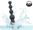 Rechargeable X-5 Silicone Power Beads 7.25 inch Black splashing in water, showcasing waterproof IPX7 feature.