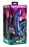 Creature Cocks Dino-Dick dinosaur silicone dildo in packaging showcasing glittering blue, black, purple, and teal colors with a suction cup base.