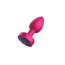 Viben Twila Twirling Light Up Vibrating Anal Plug Pink showcasing its playful design with a glowing jewel base.