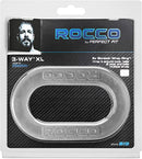 Perfect Fit Rocco 3-Way XL Wrap Cock Ring Clear packaging showcasing the stretchy band design for customizable fit.
