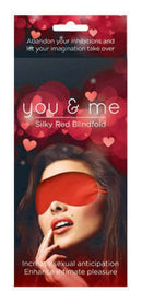 You & Me Silky Red Blindfold in packaging, designed to enhance intimacy and anticipation during romantic moments.