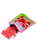 Poppin' Rock Candy Watermelon Sugar Oral Candy spilling from its packaging, showcasing the vibrant pink crystals.
