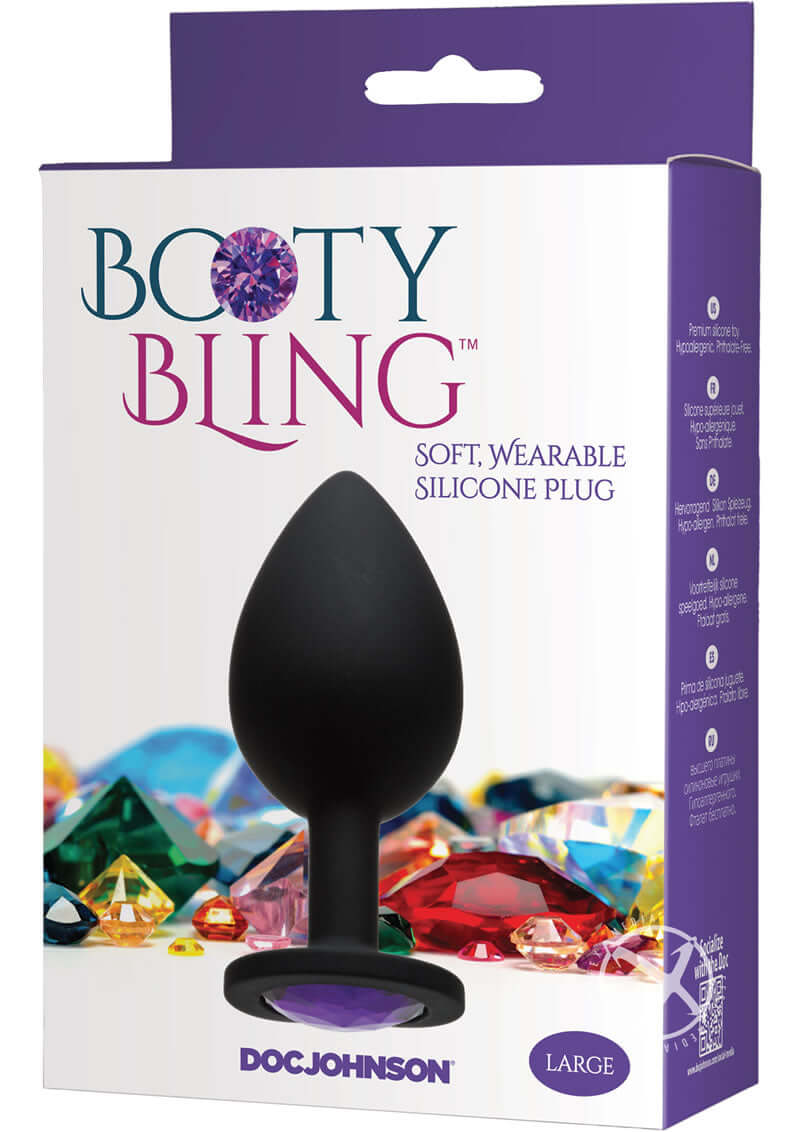 Booty Bling Large Purple butt plug in packaging with radiant gem detail on display