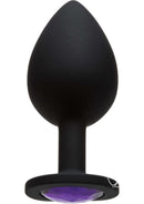 Booty Bling Large Purple butt plug with radiant purple gem and black silicone design for intimate play.
