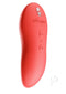We Vibe Touch X Crave Coral versatile multi-purpose vibrator in vibrant coral color for whole-body stimulation and clitoral pleasure.