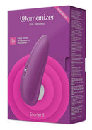 Violet Womanizer Starlet 3 in retail packaging showcasing its compact design and pleasure air stimulation features.