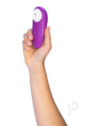 Woman holding Womanizer Starlet 3 Violet compact waterproof toy with 6 intensity levels
