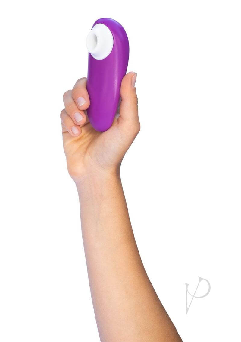 Woman holding Womanizer Starlet 3 Violet compact waterproof toy with 6 intensity levels