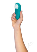 Hand holding Womanizer Starlet 3 Turquoise compact waterproof toy with 6 intensity levels