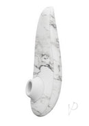 Womanizer Marilyn Monroe Special Edition pleasure device with white marble design and Pleasure Air Technology for clitoral stimulation.