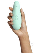 Woman holding mint Womanizer Marilyn Monroe Special Edition with Pleasure Air Technology