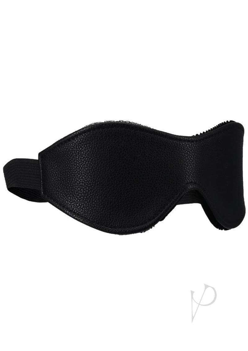 Comfortable black vegan leather blindfold with soft velvet lining for sensory deprivation and stylish intimacy.