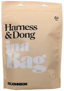 In A Bag Black Harness with Slim Silicone Dong packaging in beige bag with product details and brand logo